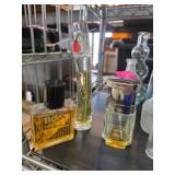 Three Fragrance Bottles Including Hugo Boss and Ot
