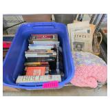 Blue Storage Bin Containing Books on Religion, Tec