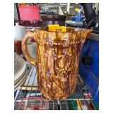 Brown Glazed Ceramic Pitcher with Raised Floral De