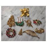 Nine Gold-Tone and Holiday-Themed Brooches