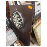 Wall-Mounted Dartboard on Wooden Backing