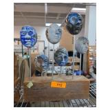 Ceramic and Wood Sculpture of Faces on Metal Rods