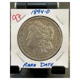 1894-O Morgan Silver Dollar in Stapled Holder