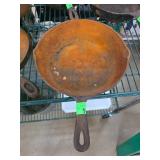Cast Iron Skillet with Rusted Interior and Marked