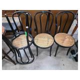 Four Black Bentwood Chairs with Cane Seats