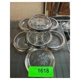 Seven Glass Coasters With Metal Rims