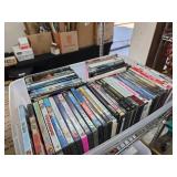 DVDs in Plastic Storage Bin