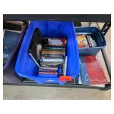 Books, DVDs, and VHS Tapes in Storage Bins