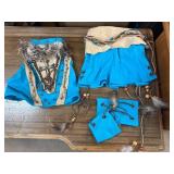 Blue and Beige Themed Costume with Feather Details