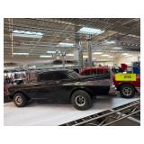 Two Vintage Model Cars in Black and Red