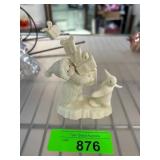 Porcelain Figurine of Child with Gifts and Penguin