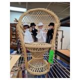 Dolls in Wicker Chair