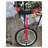 Red Unicycle With Black Saddle and Metal Frame