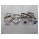 Nine Silver-Tone Rings with Various Stones