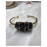 Gold-Tone Cuff Bracelet With Black Stone
