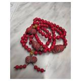 Red Beaded Necklace with Decorative Accents