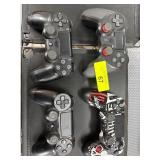 Four PlayStation Controllers