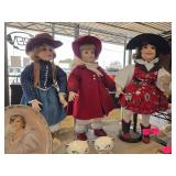 Three Porcelain Dolls in Period Attire