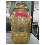 Amber Glass Jar with Lid Featuring Decorative Patt