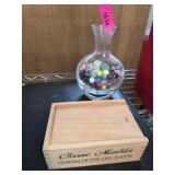 Glass Vase Filled With Marbles and Wooden Box