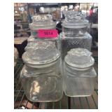 Four Clear Glass Storage Jars with Lids