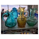 Three Crackle Glass Pitchers