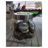 Glass Jar Filled with Assorted Coins