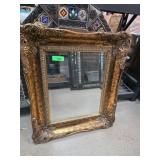 Ornate Gilt-Framed Wall Mirror