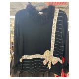 Black Top With Feather Trim and Bow Accents