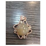 Jade Pendant with Ornate Metal Setting