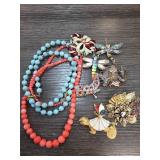 Beaded Necklaces and Decorative Brooches