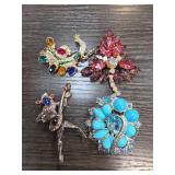 Four Colorful Costume Brooches