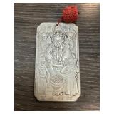Rectangular Metal Pendant With Relief Detailing