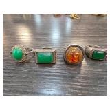 Four Metal Rings with Green and Amber Stones