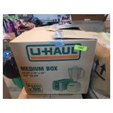 Clothes in Medium U-Haul Box