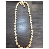 Carved Bead Necklace with Circular Clasp