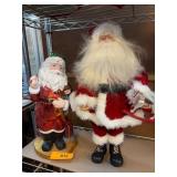 Two Santa Claus Figurines on Display