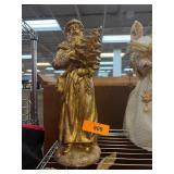 Gold-Toned Santa Figurine Holding Christmas Tree