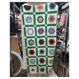 Patchwork Quilt with Green Borders and Floral Patt