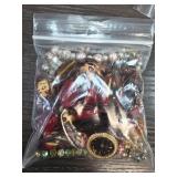 Bag of Assorted Jewelry and Figurines