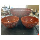 Red Mixing Bowls with Decorative Patterns