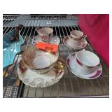 Assortment of Decorative Teacups and Saucers