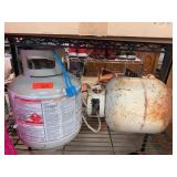 Two Propane Tanks in Mixed Condition
