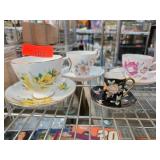 Four Decorative Teacups and Saucers