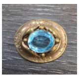 Oval Brass Brooch With Blue Stone Accent
