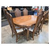 Wood Dining Table With Six Cane-Back Chairs
