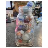 Glass Jar Filled With Colorful Marbles