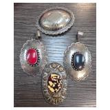 Four Ornate Metal Pendants