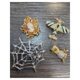 Four Decorative Brooches