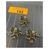 Three Octopus-Shaped Metal Decorations